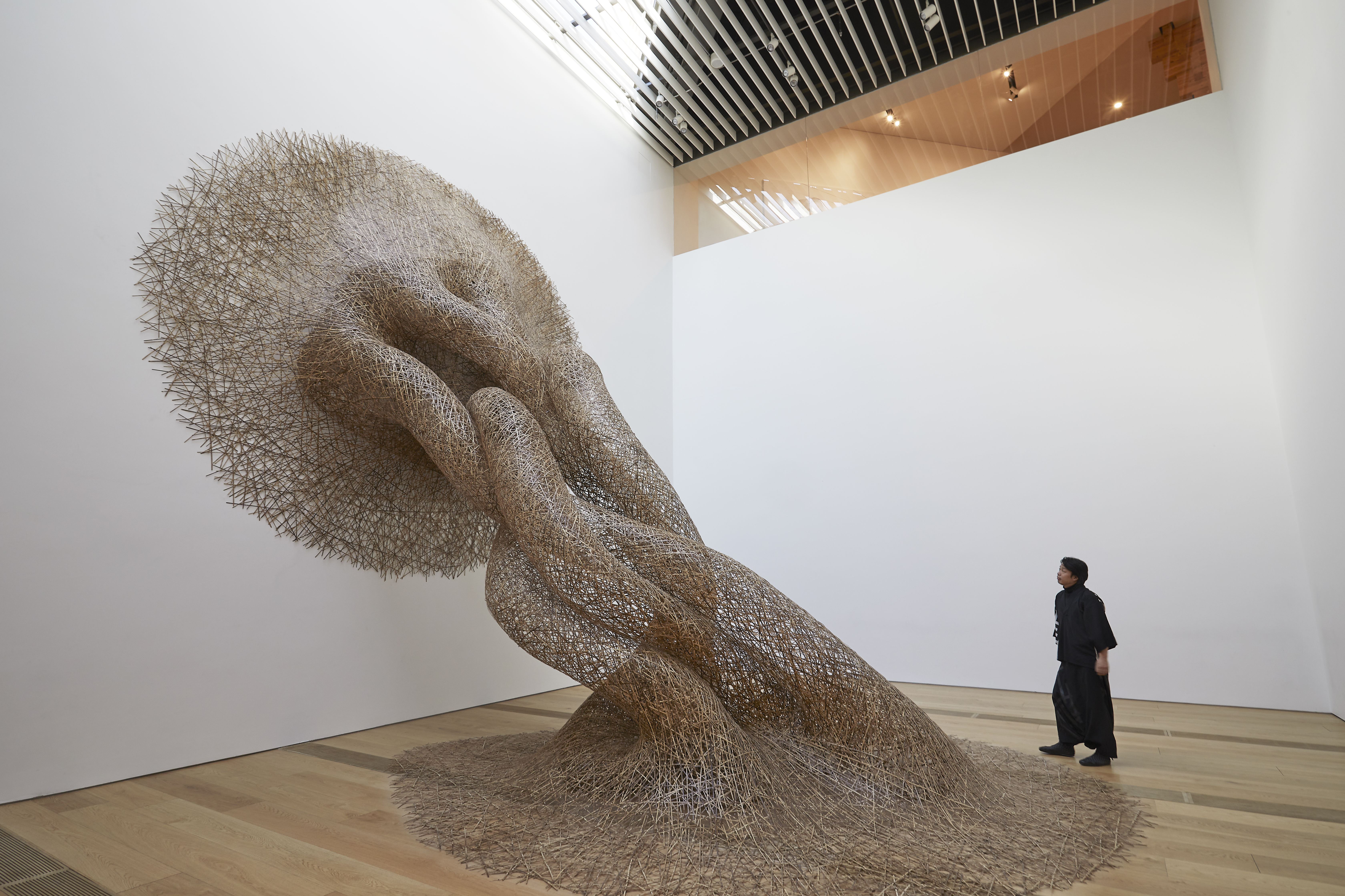 Tanabe Chikuunsai IV with his large-scale bamboo installation