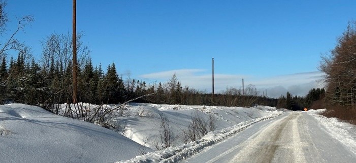 Pole installation for the NL Hydro 66 kV overhead powerline following site access road easement. February 2023