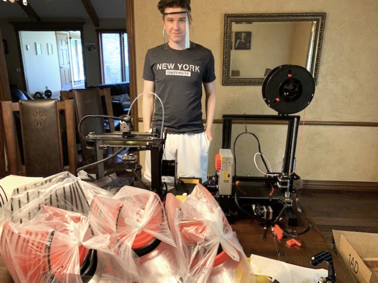 iSchool Virtual Academy 11th grader Adam Uszynski, in front of his at-home PPE printing and production operation.