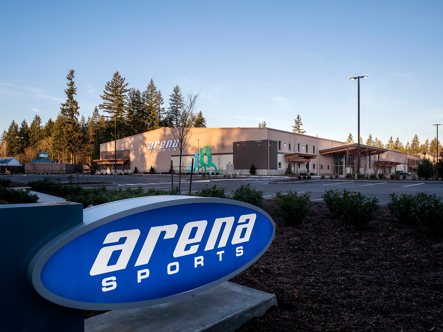 Exterior of Arena Sports location in Greater Seattle Area at twilight, acquired by Bay Club Company.