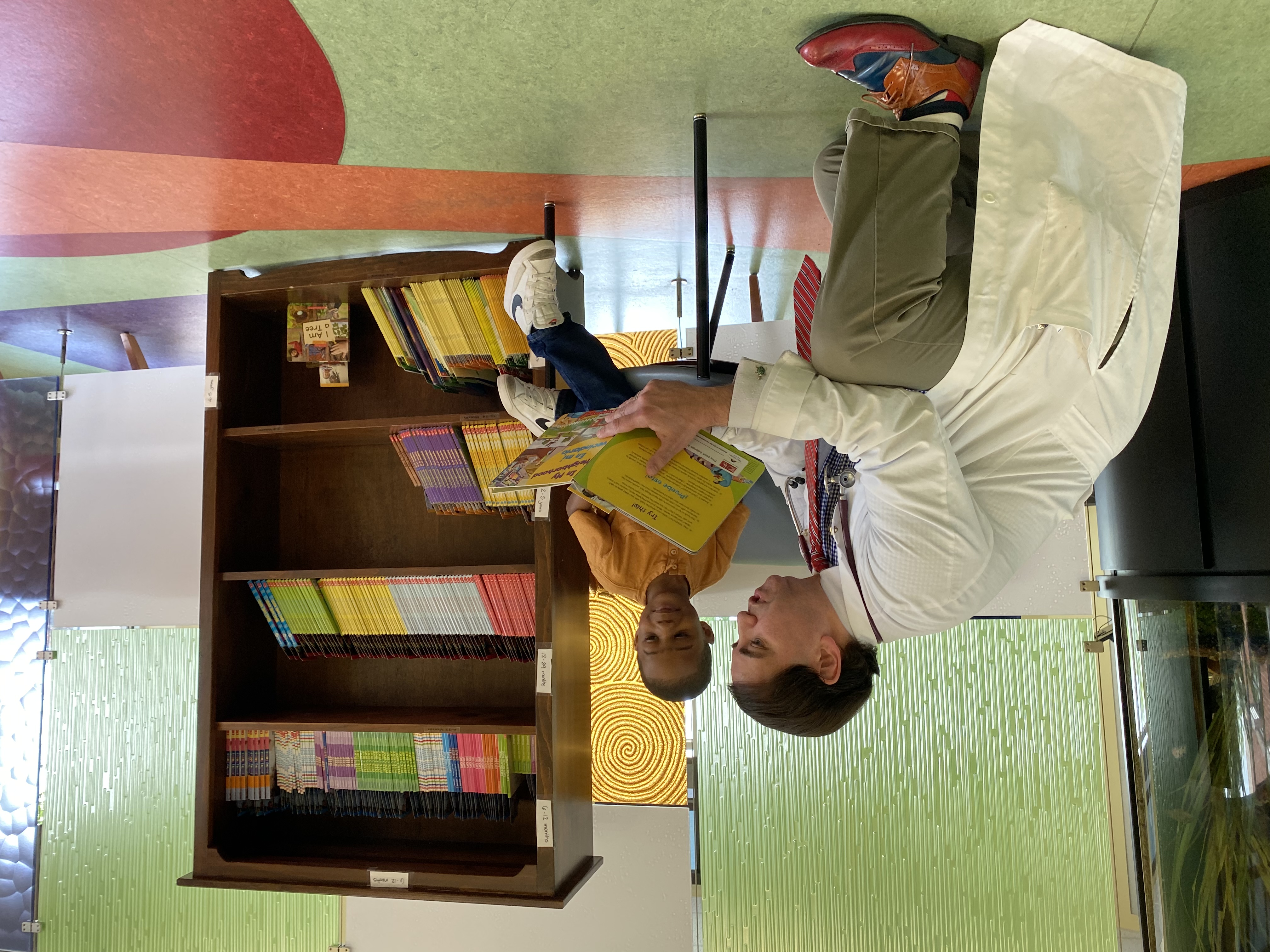 WellSpan Health's Dr. Christopher Russo Reading to a Child during Spotlight on Children's Health Announcement 