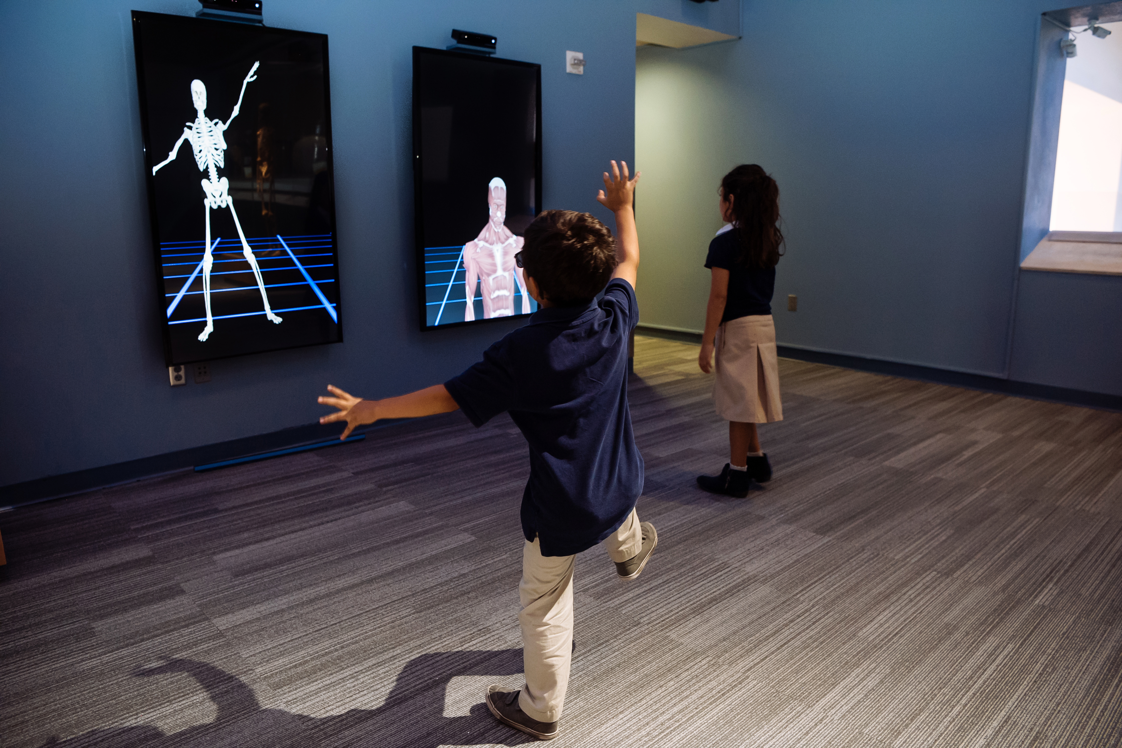 Young visitors enjoy Body Worlds Decoded at The Tech Interactive. The exhibition is the only experience in the world combining real human plastinanates with a custom Augmented Reality experience and other immersive technology for an in-depth look at how the body works. 