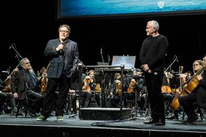 Director Jon Favreau (left) introduces composer/conductor John Debney (right) on stage. (Photo Credit: Timothy Norris)