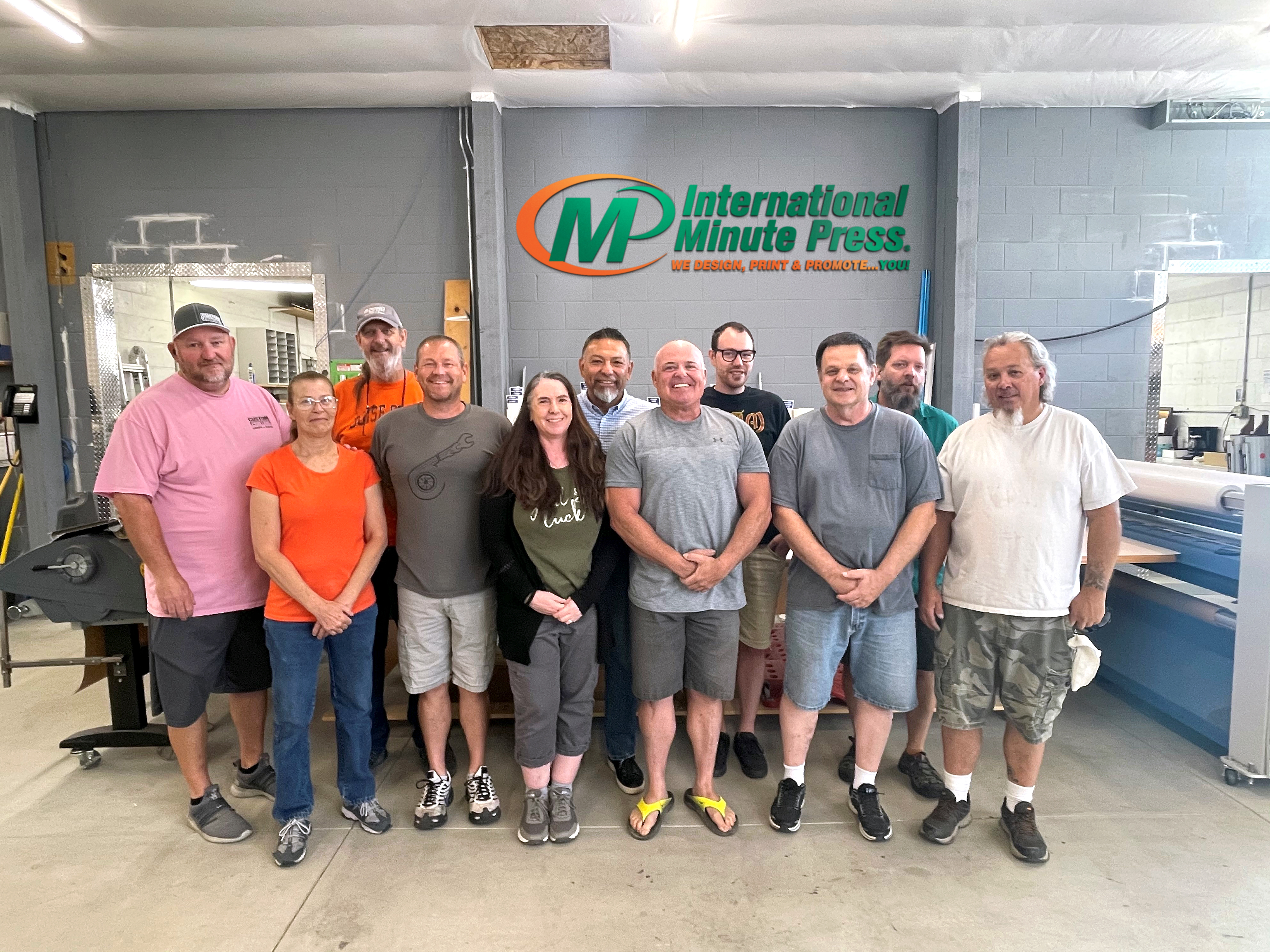 International Minute Press Nampa Staff Photo - Mike Cutler with New Owners Sheryl and James Wisler