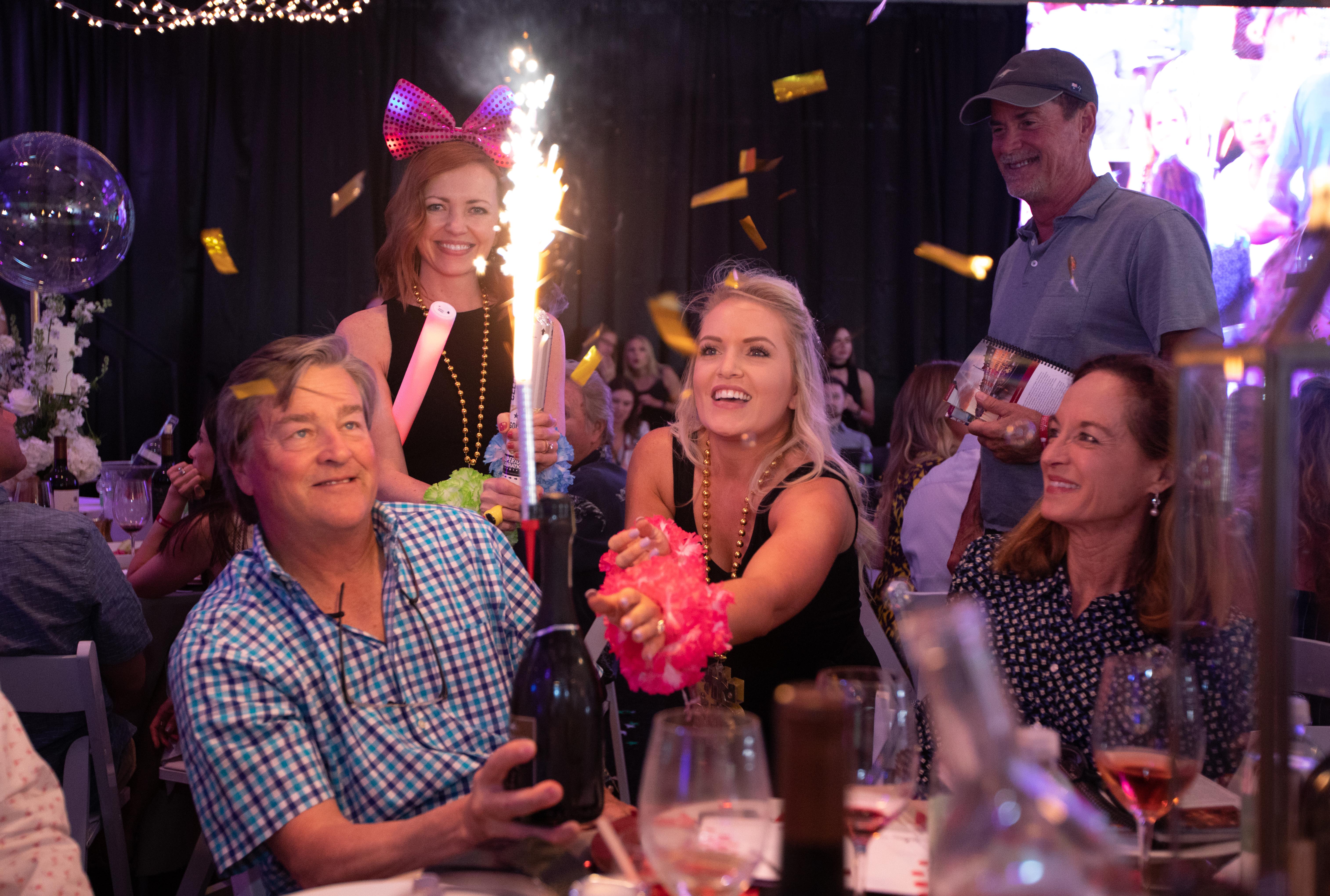 Patrons celebrate their winning bid at the 14th Annual Destin Charity Wine Auction presented by Chuck Hutton Toyota
Photo Credit: STM Photography 