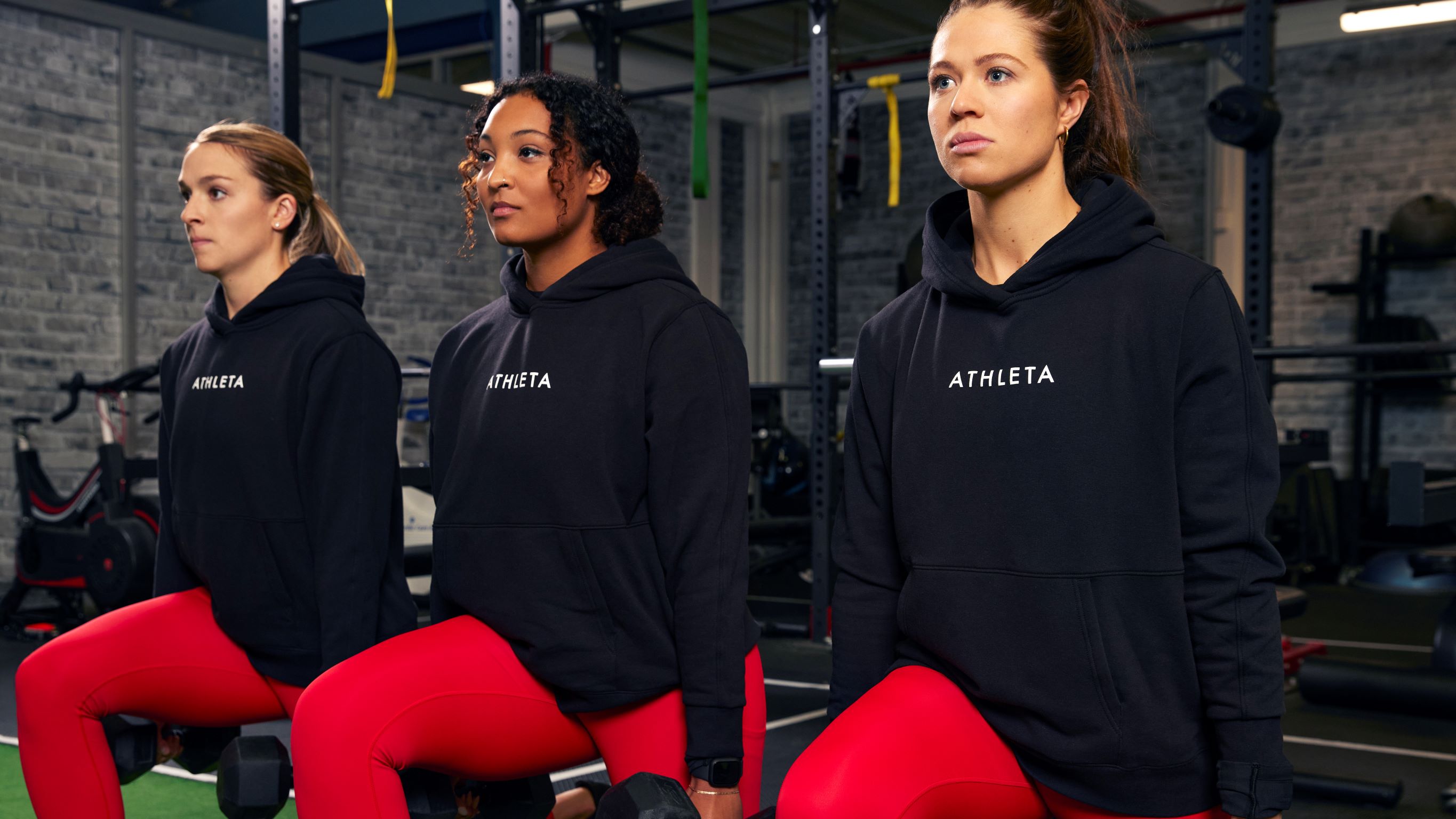 From left to right: Shiann Darkangelo, Saroya Tinker, Emma Woods of the Toronto Six workout in the weight room.