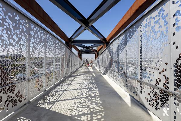 Detail view of the aluminum panels, the truss, and the structure of the Grand Avenue Park Bridge. Photo: © Adam Hunter/LMN Architects.