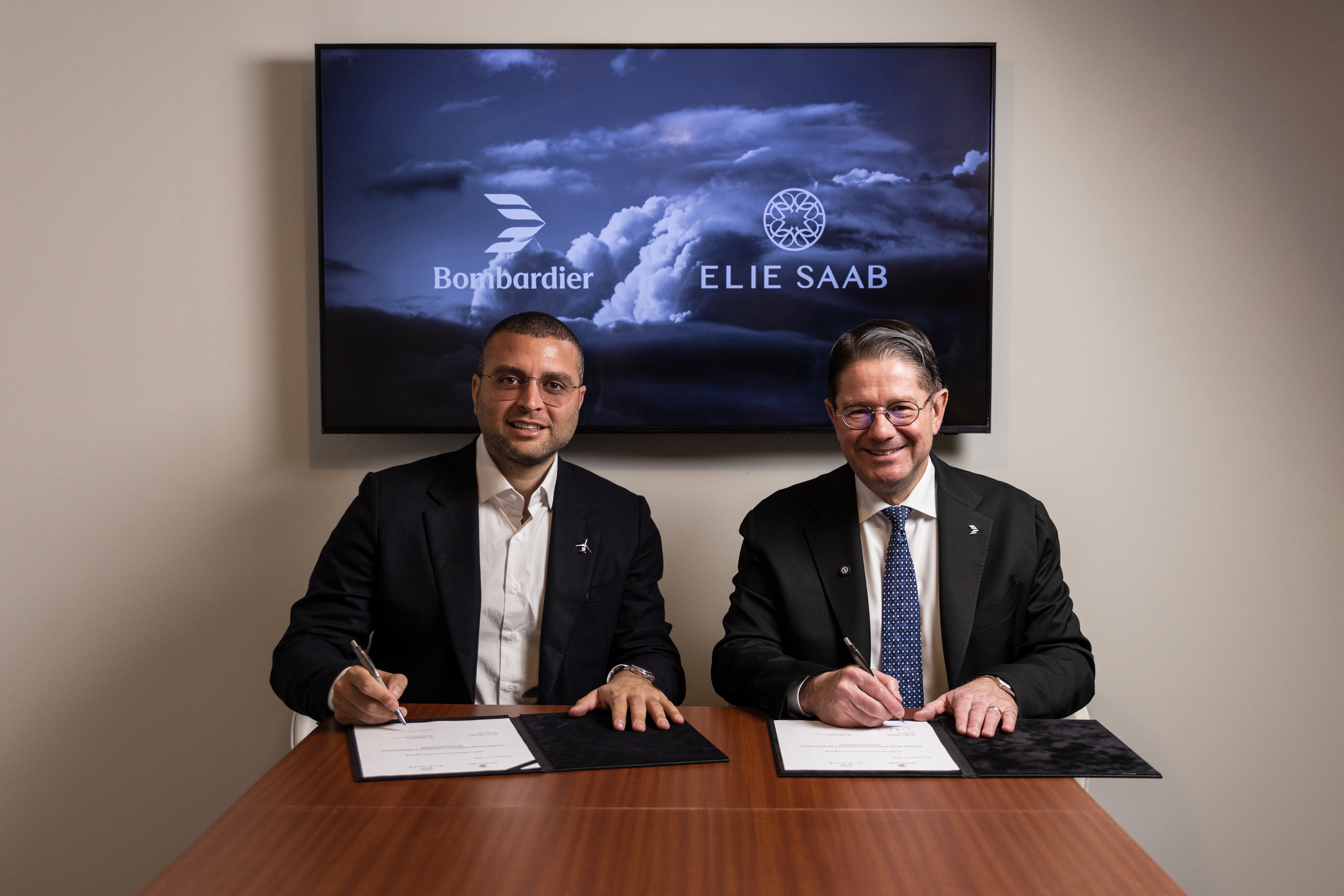 Elie Saab Junior, Vice Chairman and CEO of ELIE SAAB Group, and Éric Martel, President and CEO, Bombardier, celebrate the new collaboration between ELIE SAAB and Bombardier.