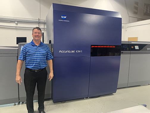 Pat McBride, Owner, Envision Printing, with its newly installed Konica Minolta AccurioJet KM-1 LED UV Inkjet Press