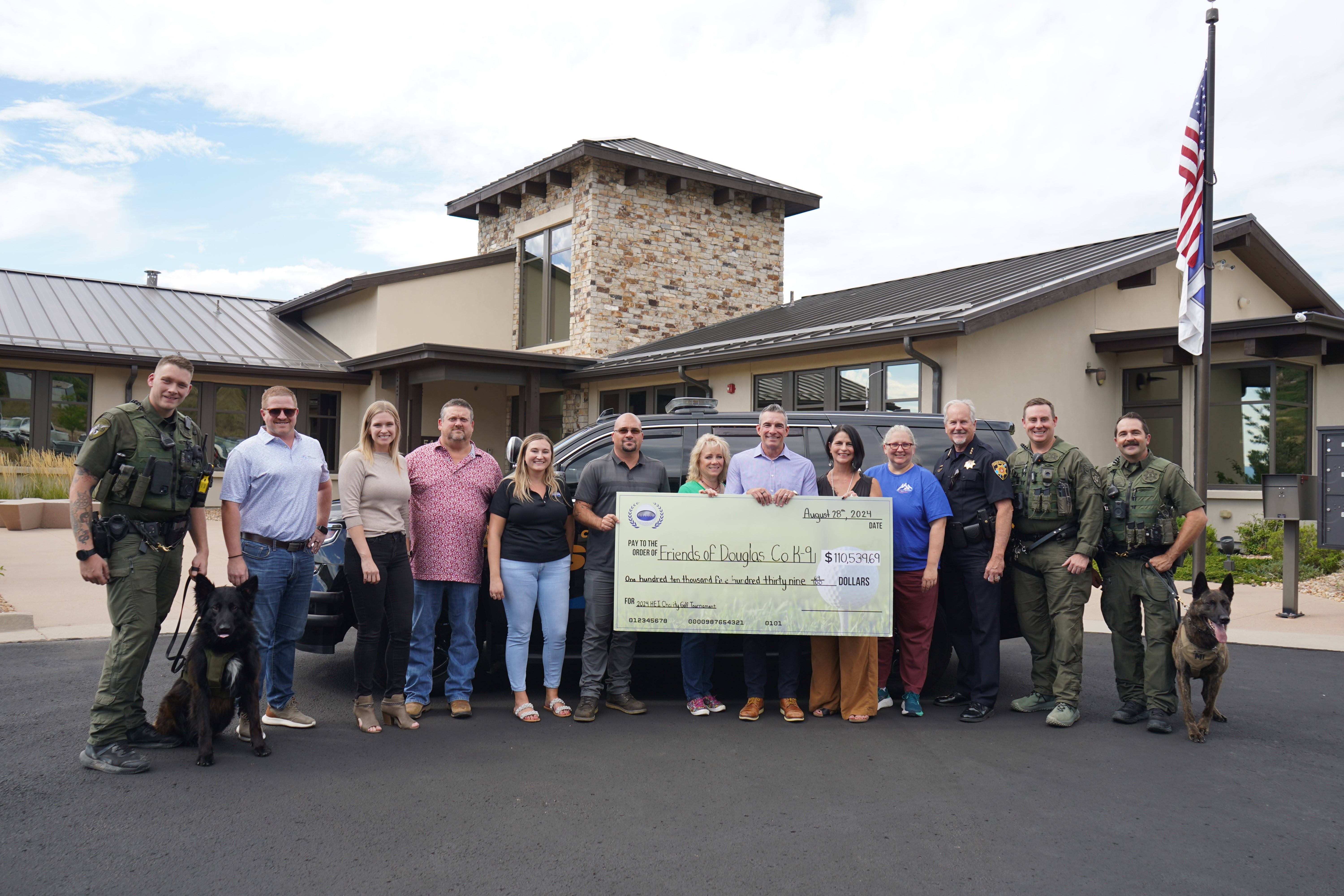 HEI Civil Presents Check to Friends of Douglas County K-9 