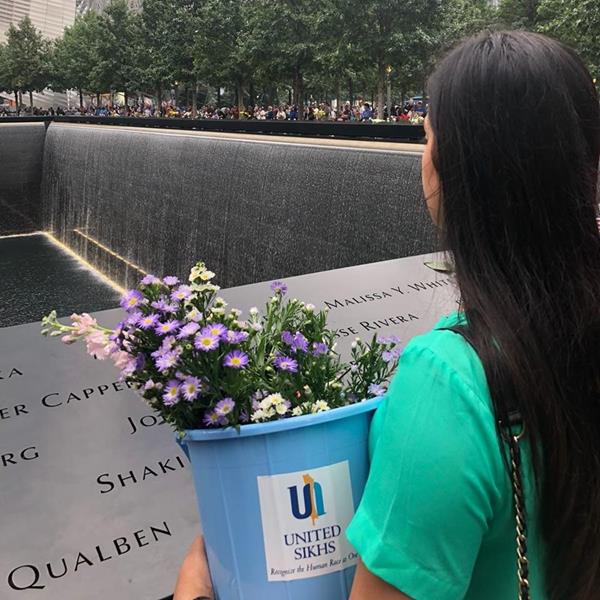 UNITED SIKHS Volunteers Paying Respects and Distributing Flowers at the 9/11 Ground Zero Memorial in Manhattan