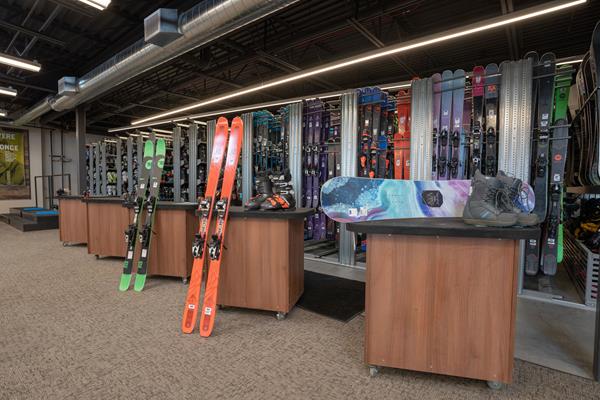 Image shows ski and snowboard rental gear at a Christy Sports store