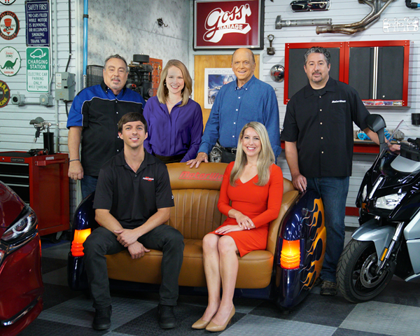 The MotorWeek team takes a break on the set. Pictured left to right are (sitting) Zach Maskell, Stephanie Hart, (standing) Pat Goss, Lauren Morrison, series host John Davis, and Brian Robinson.