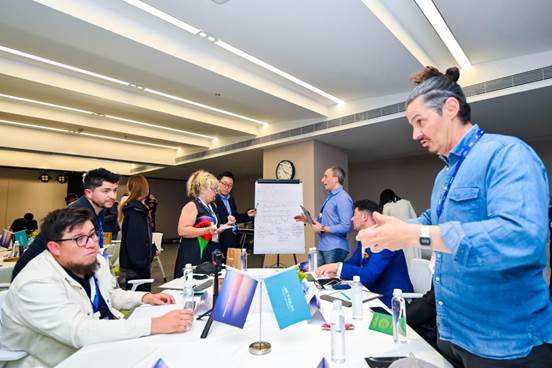 A group of people around a table  AI-generated content may be incorrect.