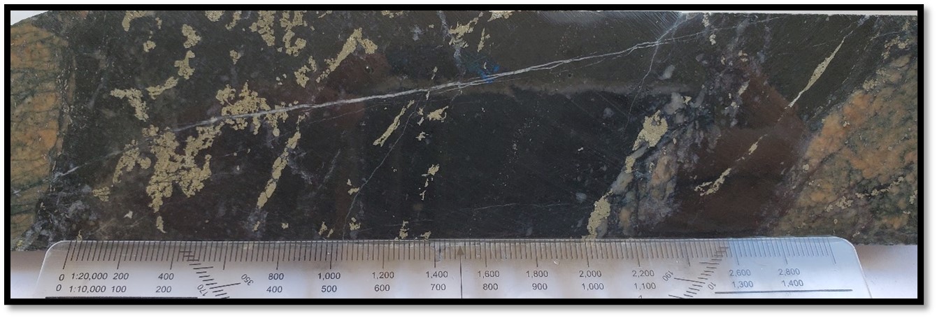 Tourmaline+quartz vein cut by pyrite±chalcopyrite and later calcite fractures within TH21-7 @ 69.50m.