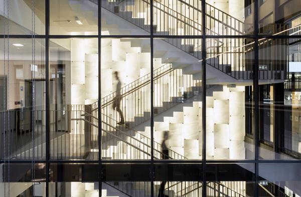Biomedicum, Sweden by C.F. Möller Architects. Photo by Mark Hadden. The multi-story staircase in this state-of-the-art biomedical facility is clad in backlit, gently swirling “Streaky” Lamberts® mouth-blown art glass. 