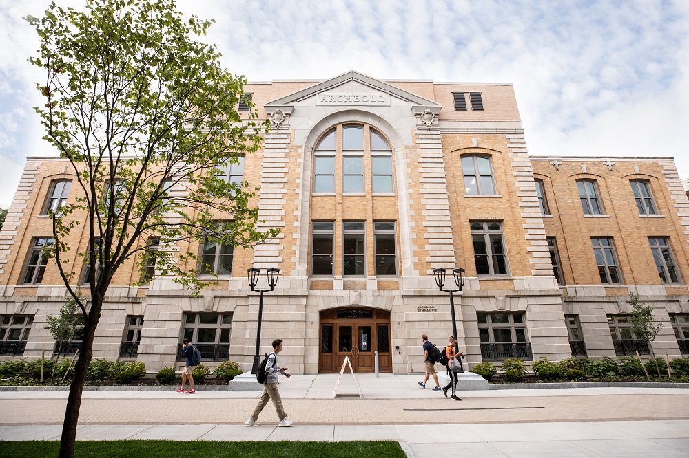 People walk past the Barnes Center at the Arch, a new state-of-the-art health, wellness and recreation complex at Syracuse University. In addition to recreational fitness and personal training, students will also find health clinics, nutritional advice and stress management, meditation resources and mental health counseling in a central location.