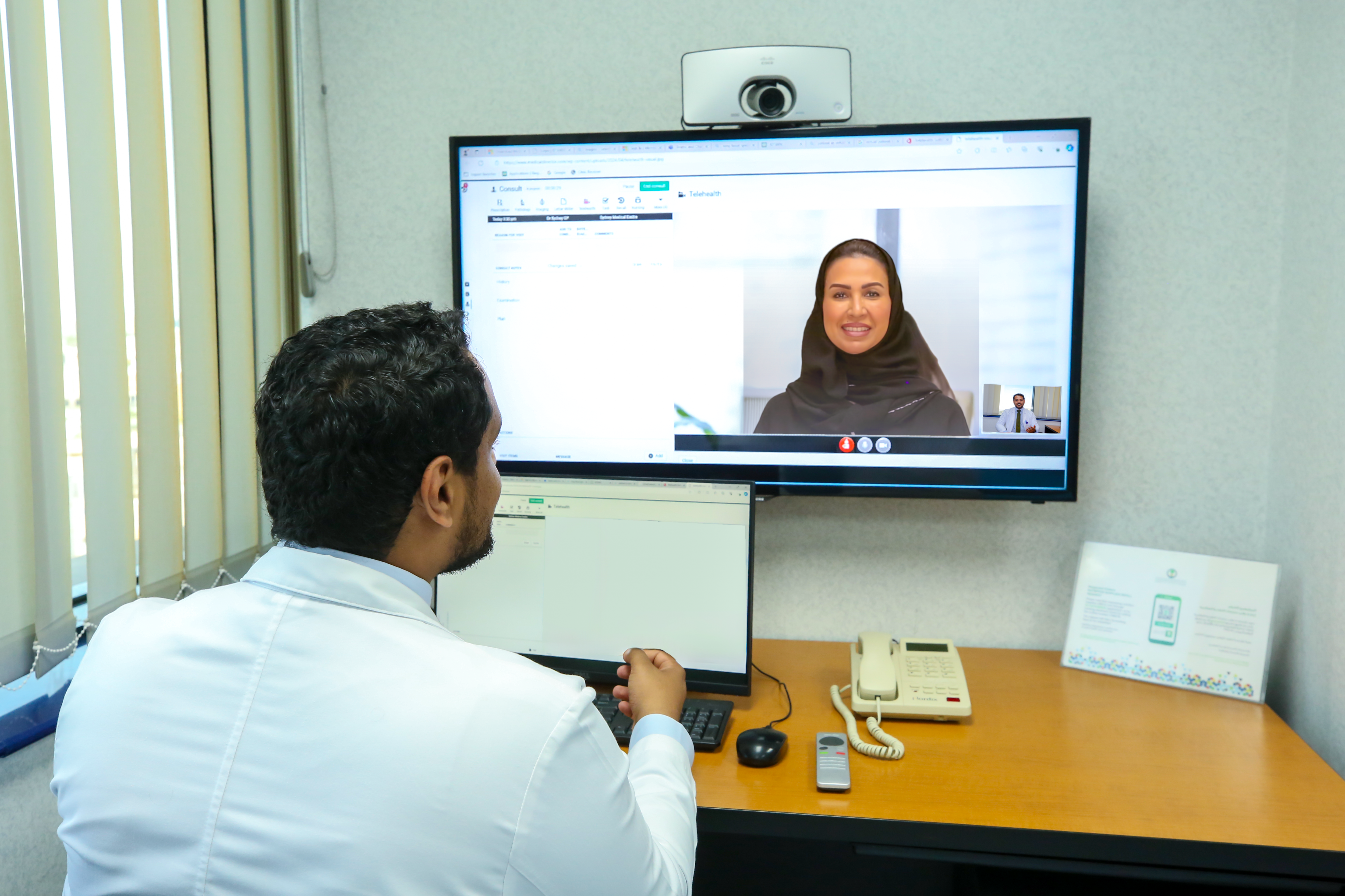 A physician at KFSHRC provides real-time guidance through the 24/7 Emergency Department Virtual Clinic, supporting patients and their caregivers remotely.
