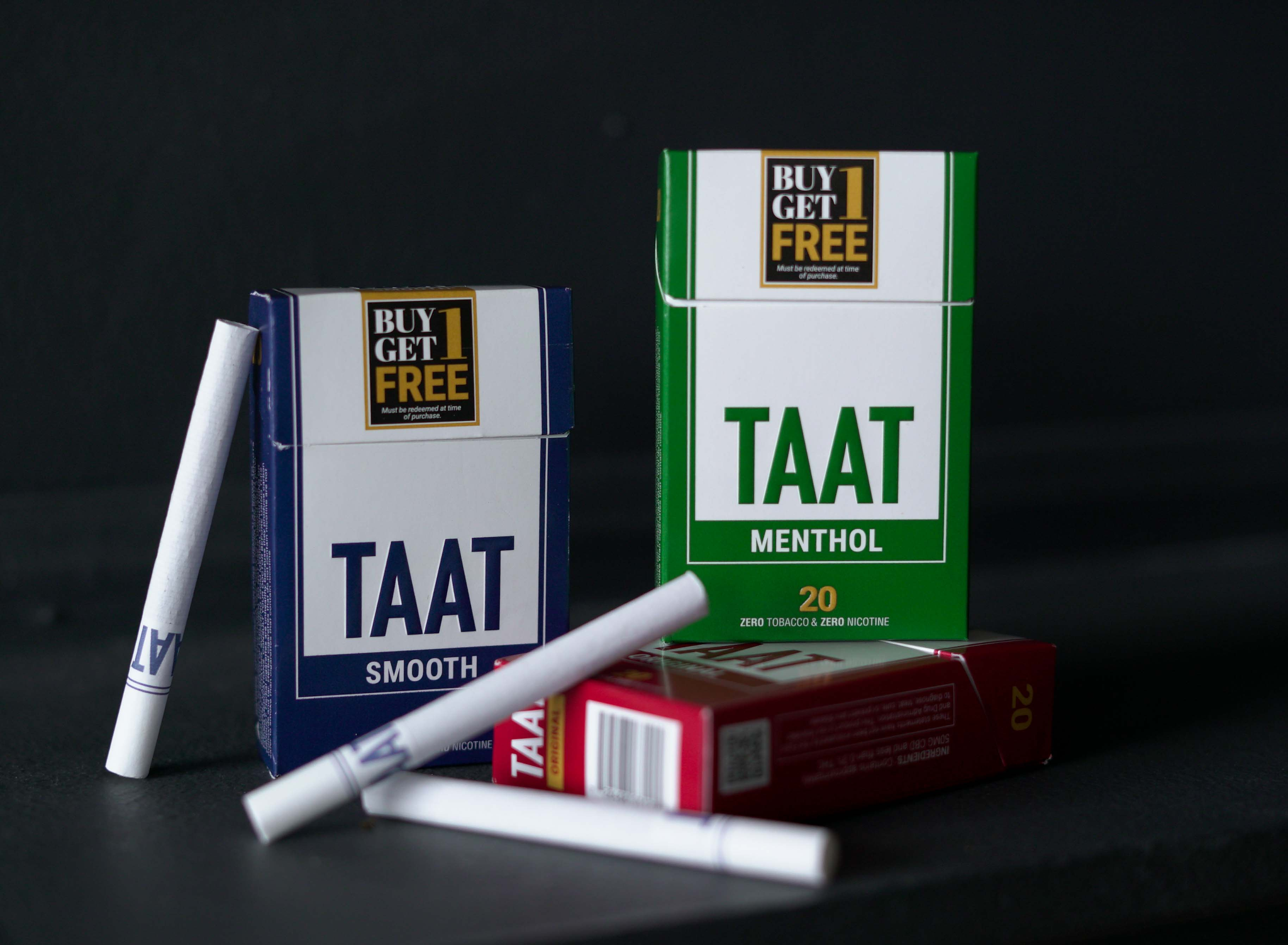 The packs for TAAT™ Smooth (left), Menthol (right), and Original (bottom) have been designed by the Company to closely emulate the appearance and textures of packs of leading tobacco cigarette brands. The pack design versions shown above were the first to be sold at retail in the state of Ohio, featuring the early-stage “BOGO” promotion to encourage smokers aged 21+ to undertake lengthier initial trials of the product with a second pack at no additional cost.