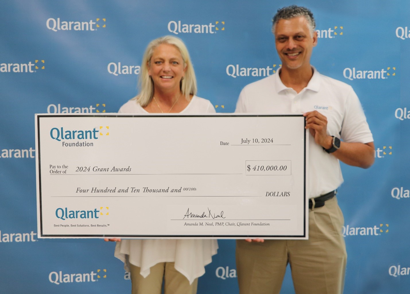 Qlarant Foundation Board Chair Amanda M. Neal and Qlarant CEO Dr. Ron Forsythe, Jr. presented $410,000 to the 2024 Grantees