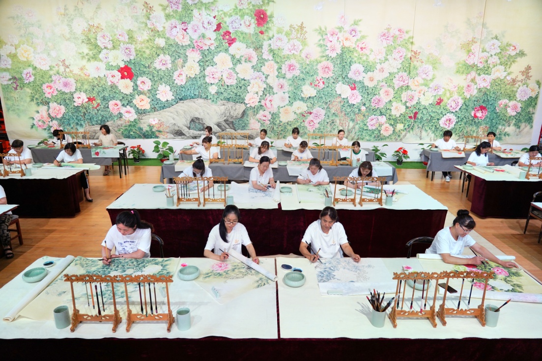 Farmer-artists create exquisite peony paintings at the Juye Fine Brushwork Peony Painting Research Institute.