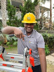 Sam Bazile is a fiber installation technician for IQ Fiber, a residential fiber-optic internet service provider expanding into Gainesville. IQ Fiber has announced plans to establish a satellite office here and hire over 30 new local employees to serve North Central Florida.
