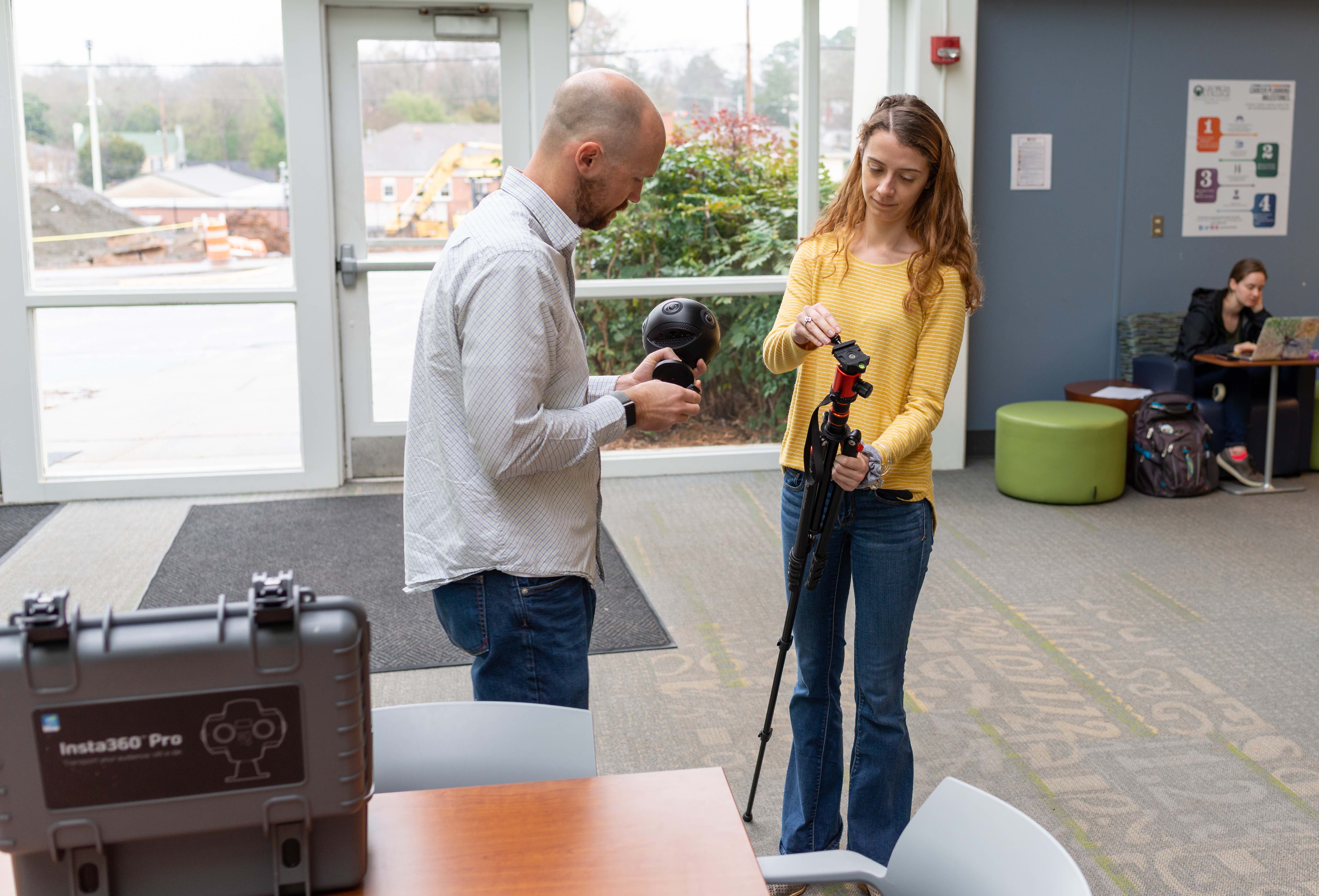 Dr. Chris Greer, professor of instructional technology at Georgia College, and graduate student Hannah Jones working with the 360-degree camera.