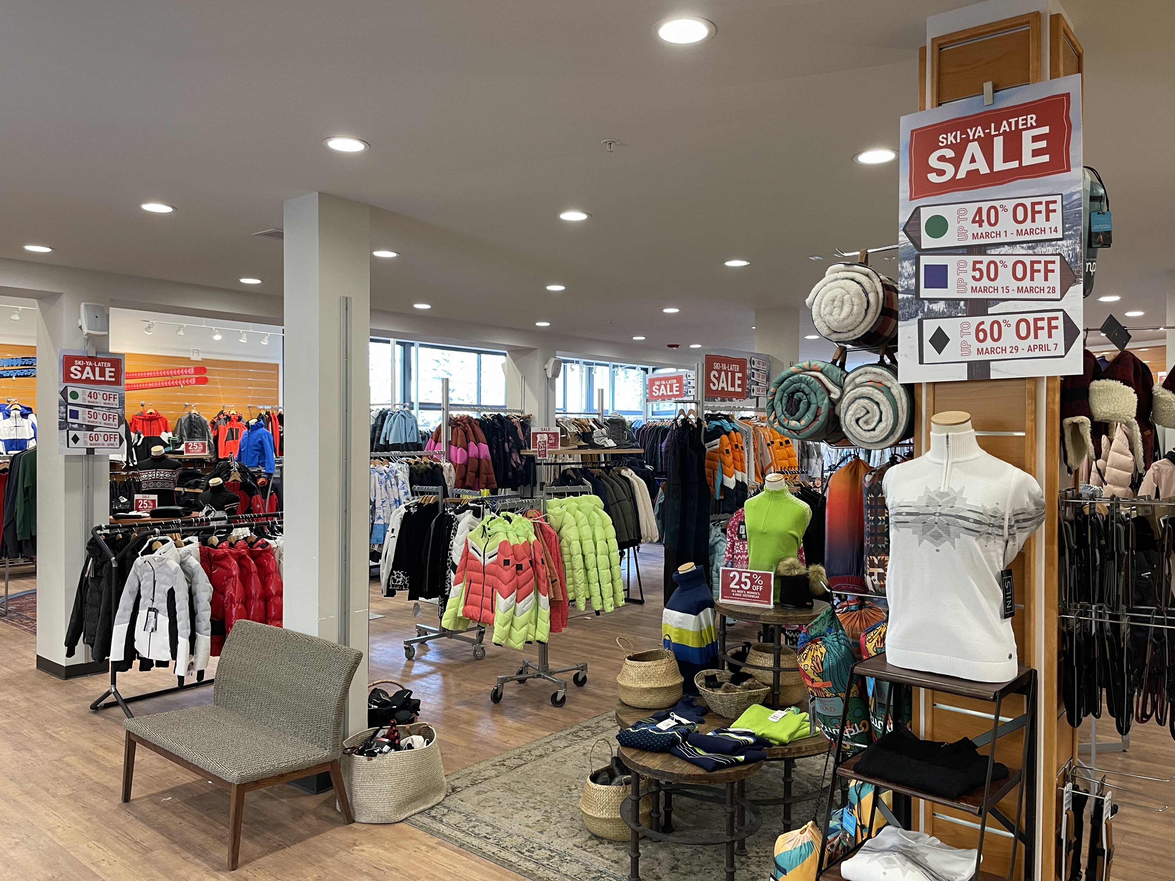 Image shows winter gear and apparel for sale inside a Christy Sports store