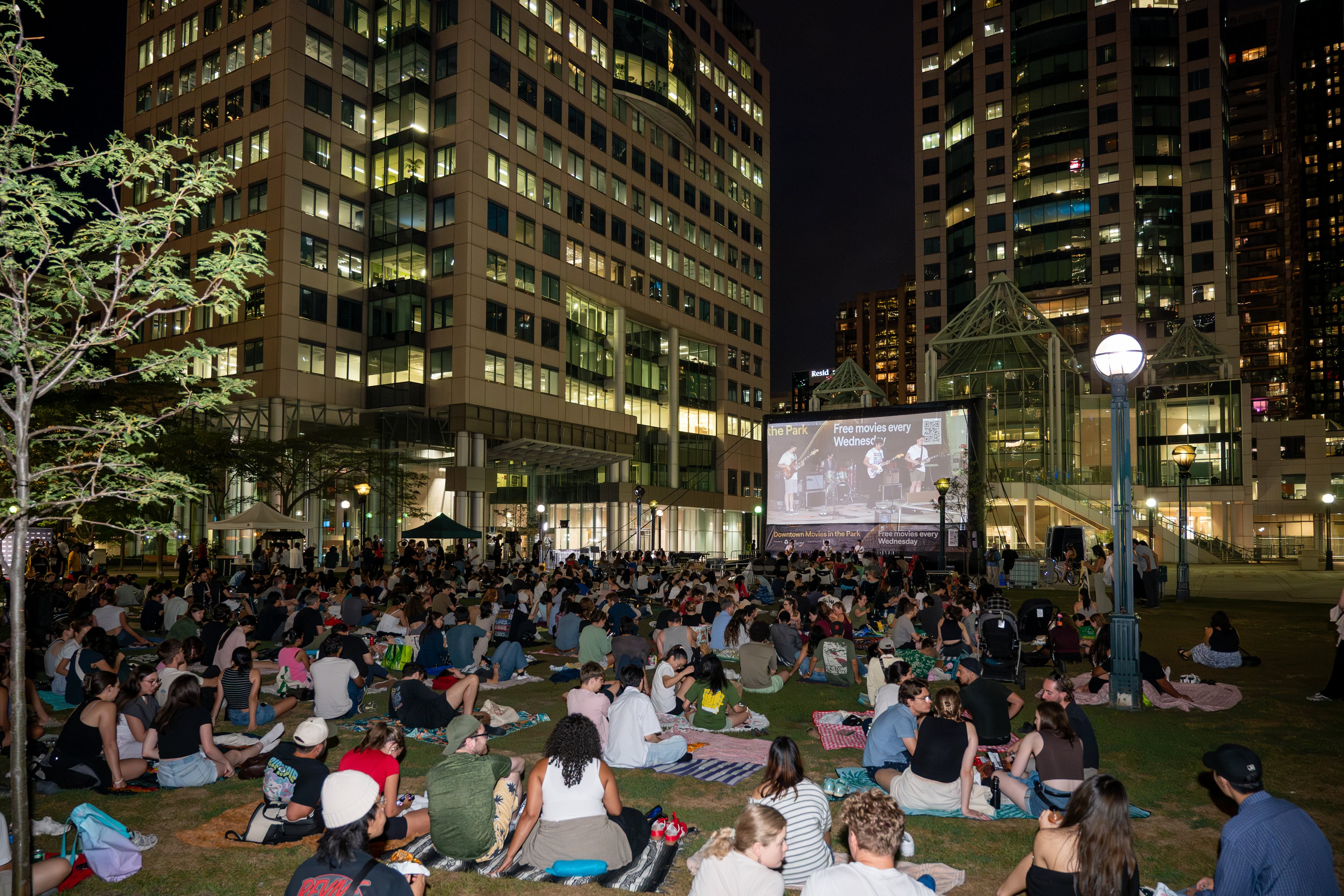 Downtown Movies in the Park returns to David Pecaut Square this summer, turning the heart of Toronto's Downtown West into a free outdoor cinema beneath the city skyline. Presented by the Toronto Downtown West BIA in partnership with the Toronto International Film Festival, the series runs Wednesdays from June 24 to July 29 with six underdog sports films. Each night opens with a 9 p.m. pre-show of live performances ahead of the 9:30 p.m. screening, and all films include open captions. Part of the BIA's "See You Downtown" summer programming.
