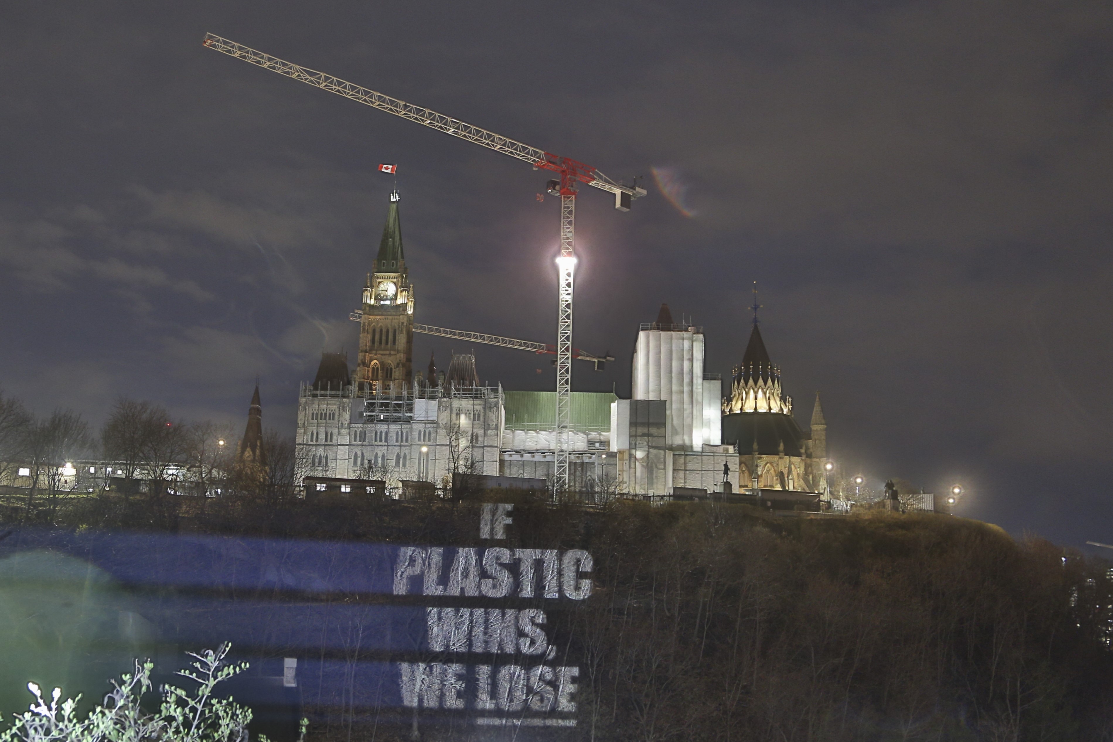 "If Plastic Wins, We Lose" is projected on Parliament Hill, on Monday, April 22, 2024 by Oceana Canada and EARTHDAY.ORG. The illuminated message urges global leaders to negotiate a strong, legally-binding treaty to end plastic pollution.