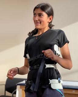 Patient wearing Green Sun Medical's Whisper Scoliosis Brace.