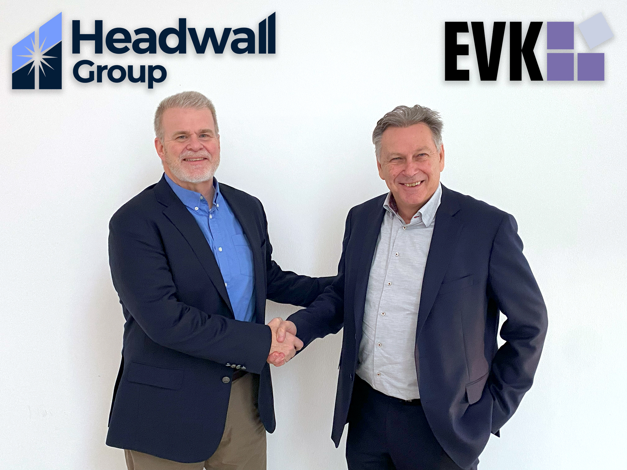 Mark Willingham, CEO of Headwall (left), and Matjaz Novak, CEO of EVK (right), shake hands as EVK is brought into the Headwall Group of companies, significantly enhancing the group's portfolio and bolstering its presence in the industrial machine vision market.