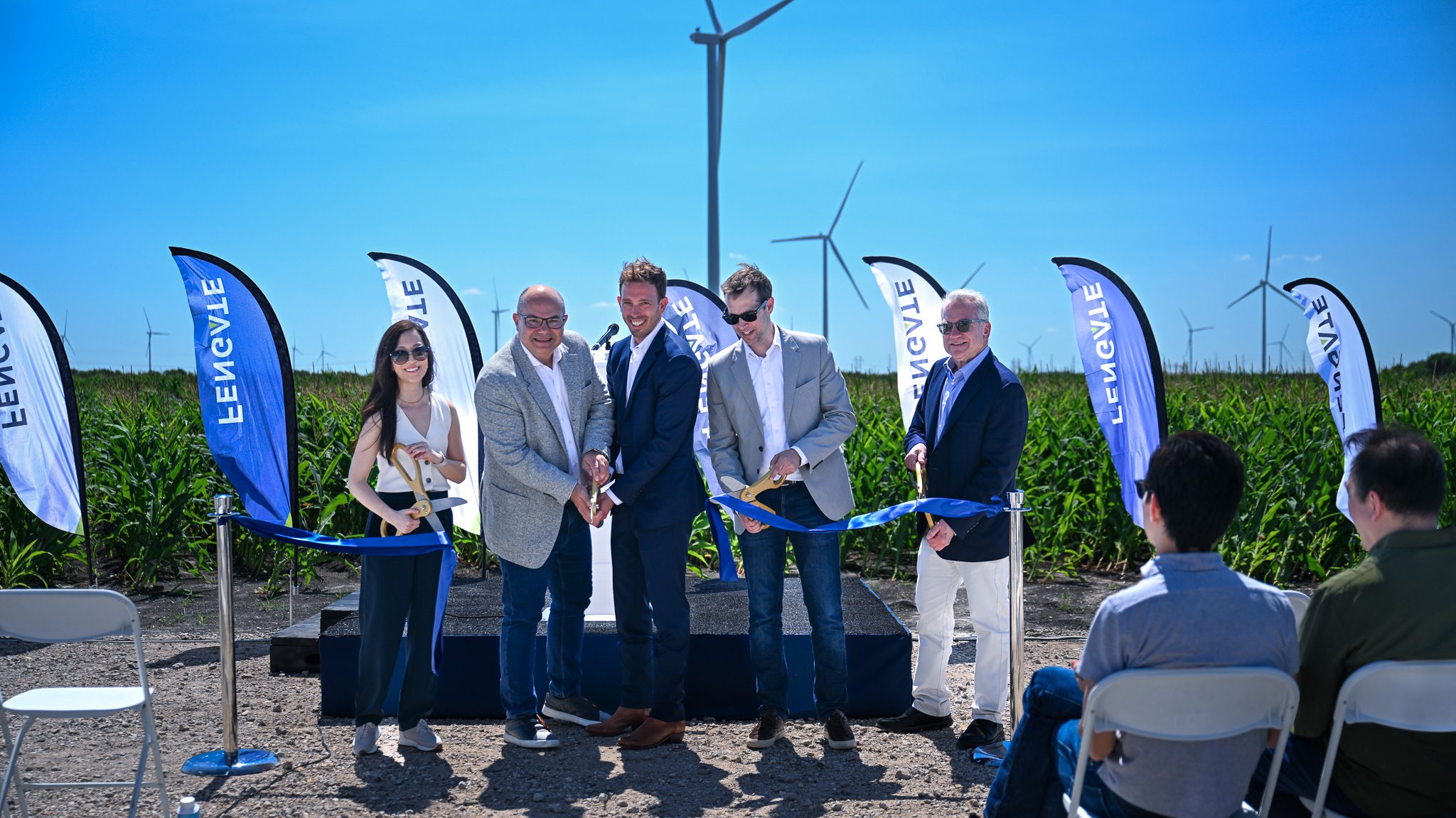 Nina Yoo (Fengate), George Theodoropoulos (Fengate), Greg Calhoun (Fengate), Andrew Cogan (Fengate) and Jim Spencer (Exus) cut the ribbon for the Prairie Switch Wind project.