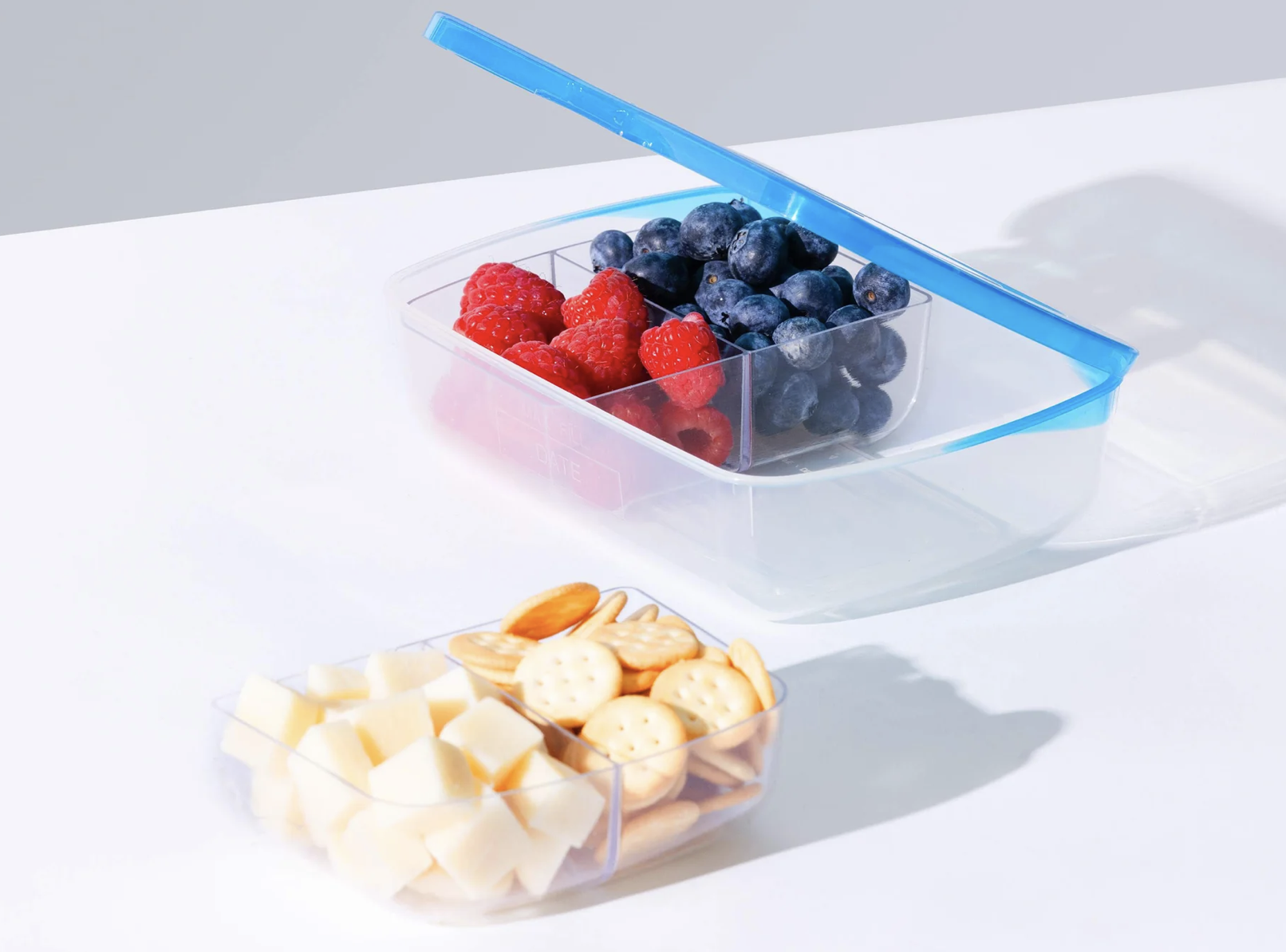 The 19oz Sandwich Container (Dimensions: 7” x 5.25” x 1.75”) easily fits a sandwich, and when used with its specially designed bento insert (sold separately), can cozily fit side food items like fruit and pretzels. The inserts come two to a pack, turning the Sandwich Container into three or four sections. The top for the Sandwich Container comes in 6 color options, perfect for the pickiest lunch friends. Price: $5.99 for the Sandwich Box, $4.75 for its Bento insert.