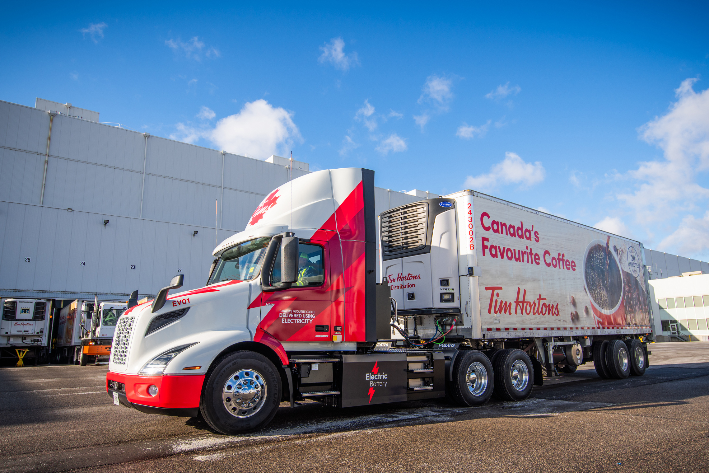 Volvo Trucks North America customer Tim Hortons took delivery of its first two Volvo VNR Electric trucks to transport grocery products, including its beloved coffee and doughnuts, from Tim Hortons’ distribution centers in Guelph, Ontario and Langley, British Columbia to local stores and restaurants.