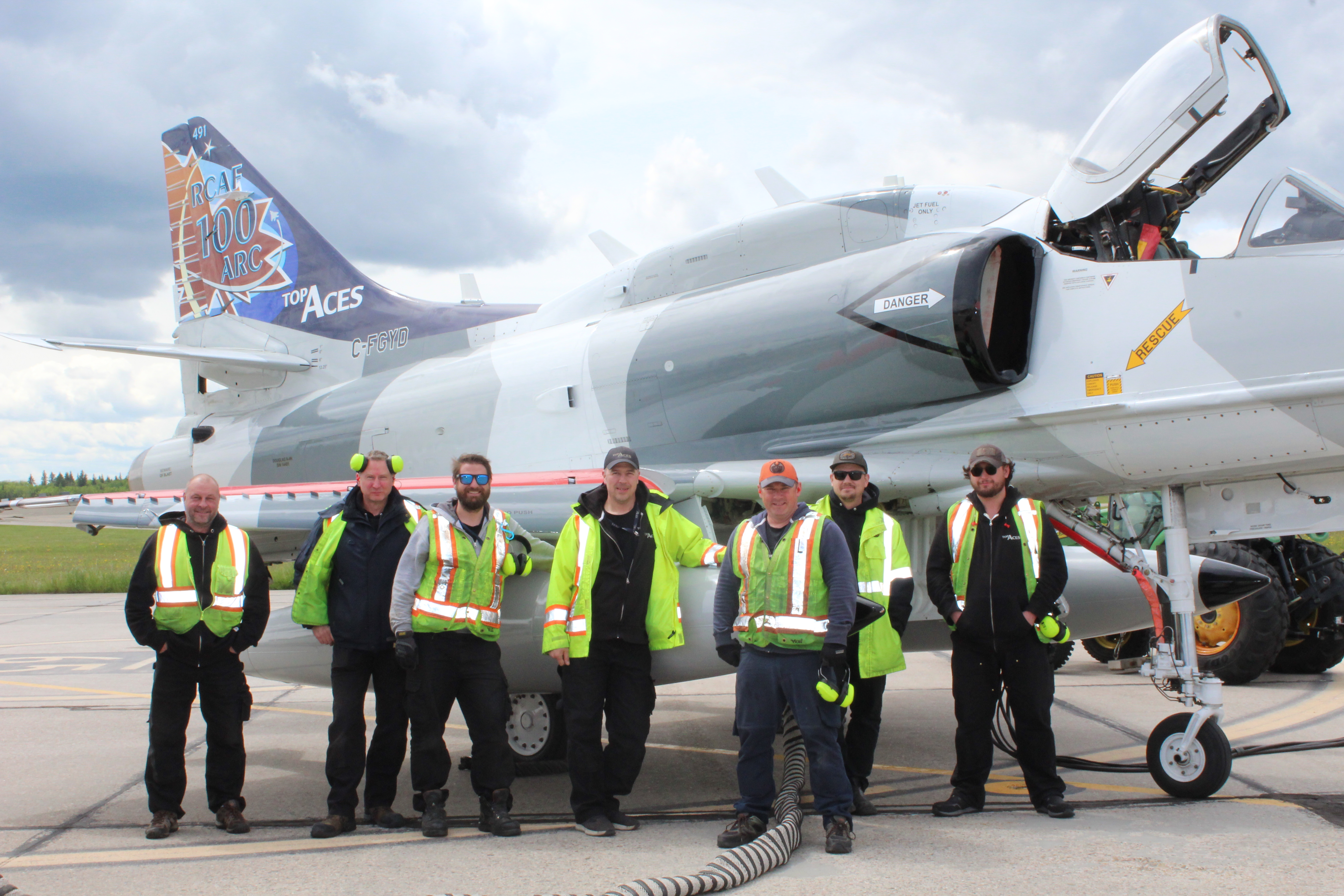 Top Aces technicians at RCAF airbase in Cold Lake before the successful completion of the A-4 AAF Skyhawk’s first training mission, preparing CF-18 pilots for advanced threats as part of the Contracted Airborne Training Services (CATS) program.