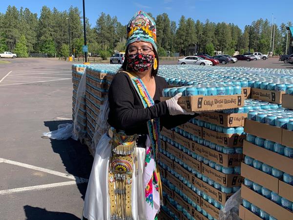 Can'd Aid volunteer distributes water on the Navajo and Hopi nations for COVID-19 relief efforts.