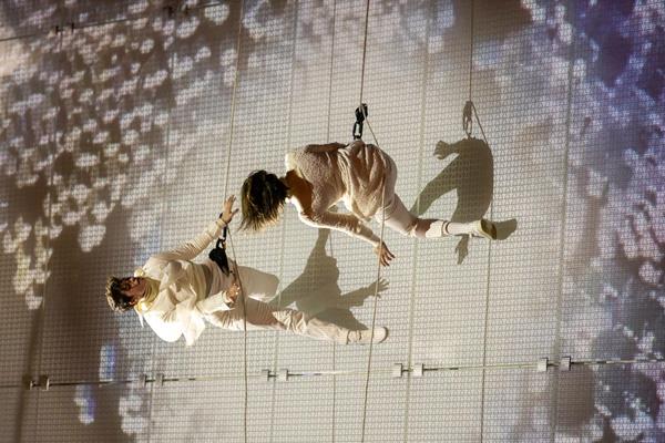 The opening night at the museum was celebrated with an enigmatic dance on top of the glass façade by the group BANDALOOP, a pioneer in vertical performance. Photo courtesy of BANDALOOP.
