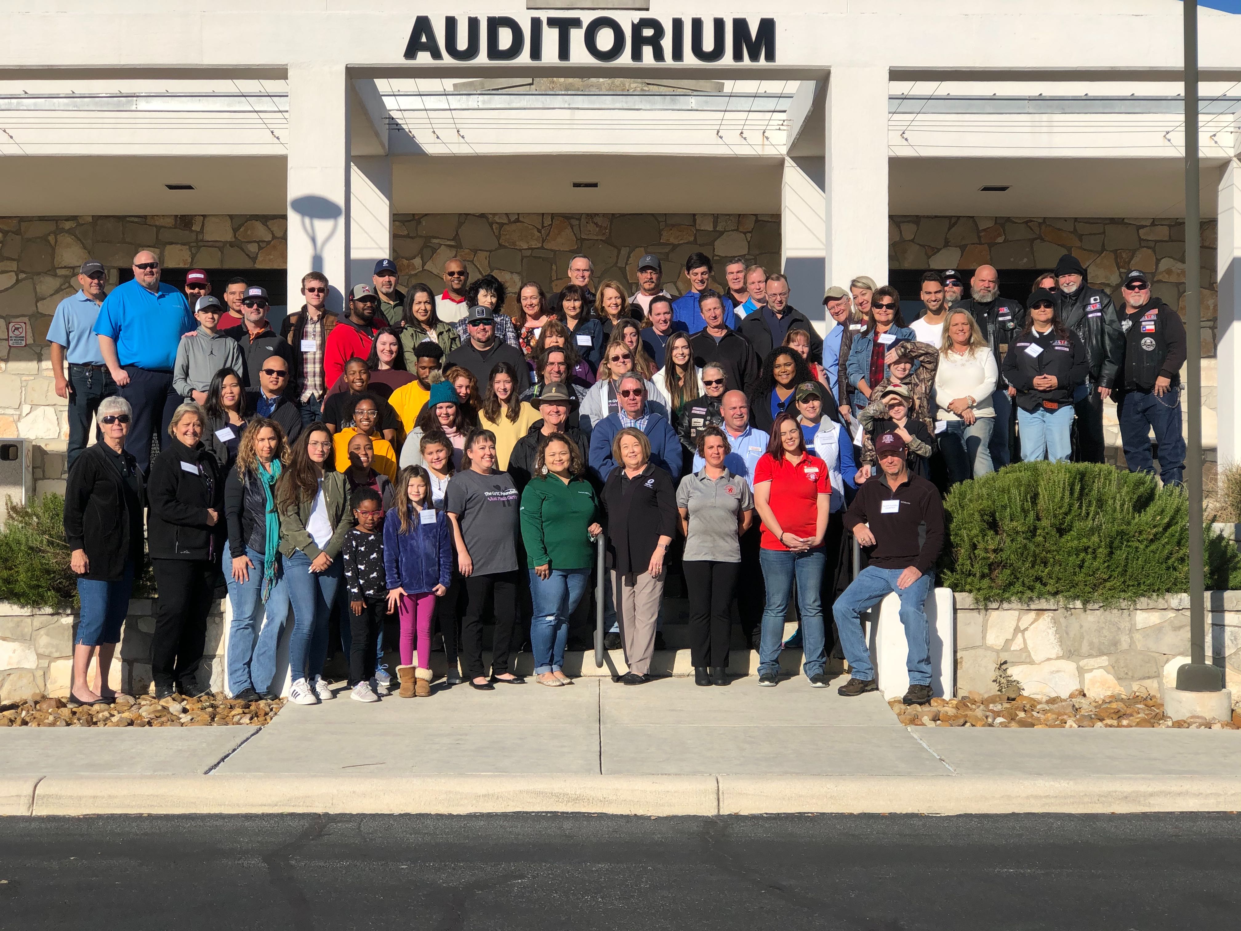 GVTC employee volunteers and their families at SV office on Delivery Day