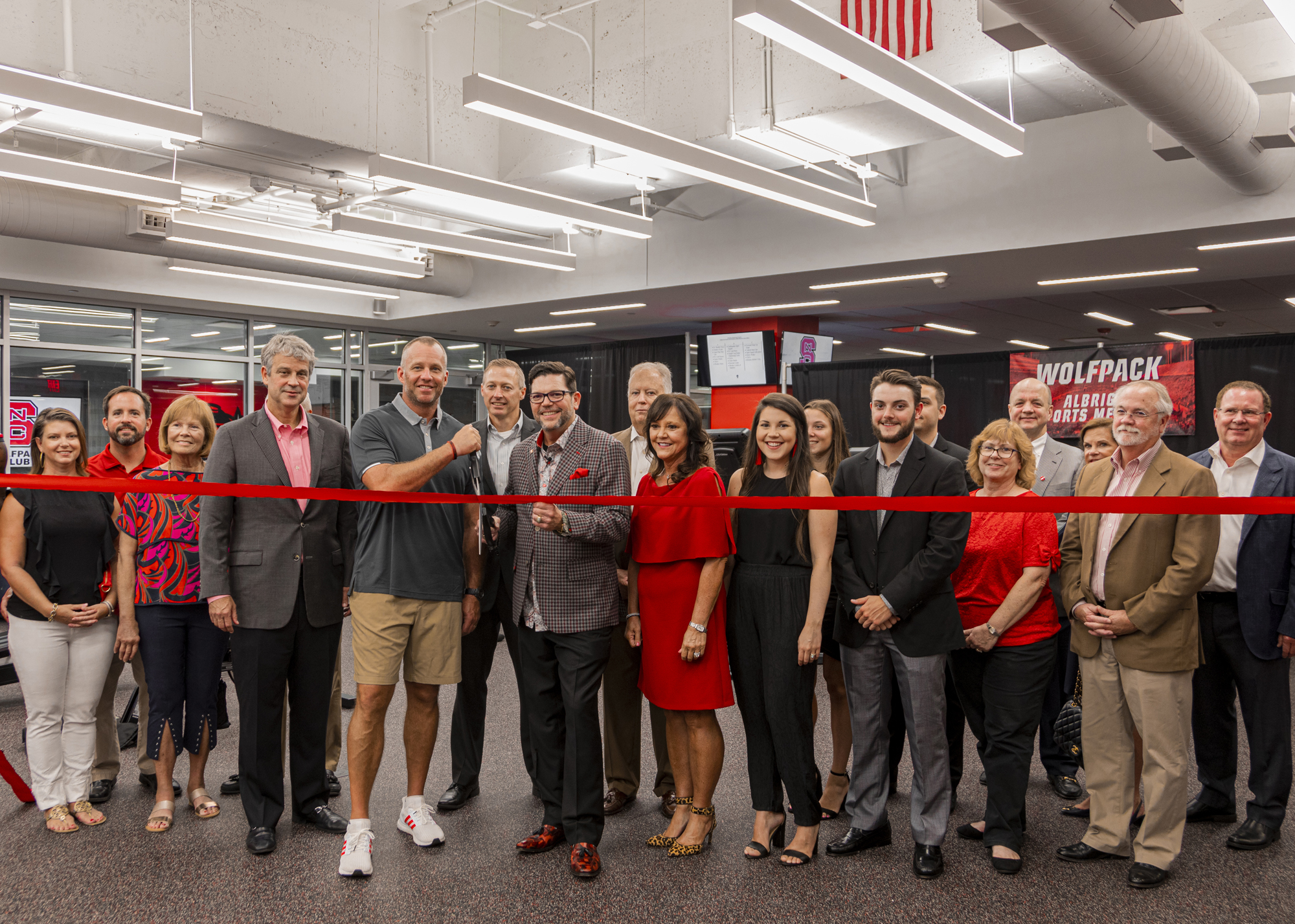 The Albright family celebrate the opening of the Albright Sports Medicine Center at NC State University with NC State football coach Dave Doeren.