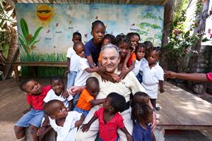 Robin Mahfood with children in Haiti.