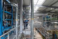 a-group-of-employees-stands-inside-apk-ags-factory-in-merseb.JPG